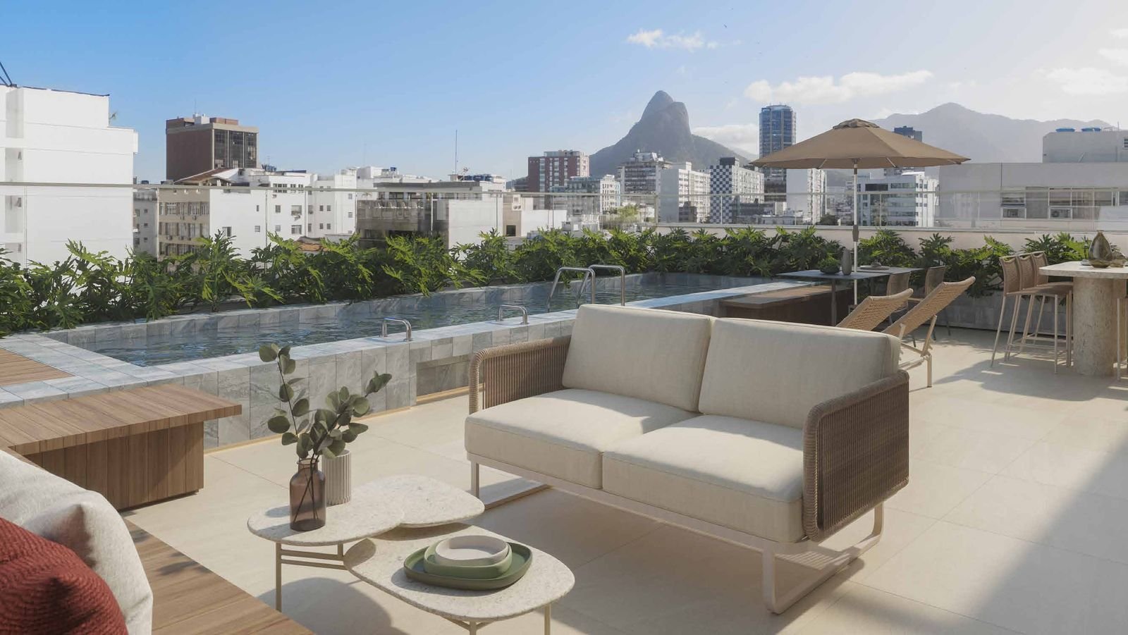 Lounge descoberto no rooftop do Be.in.Rio Barão da Torre com vista para o Morro Dois Irmãos