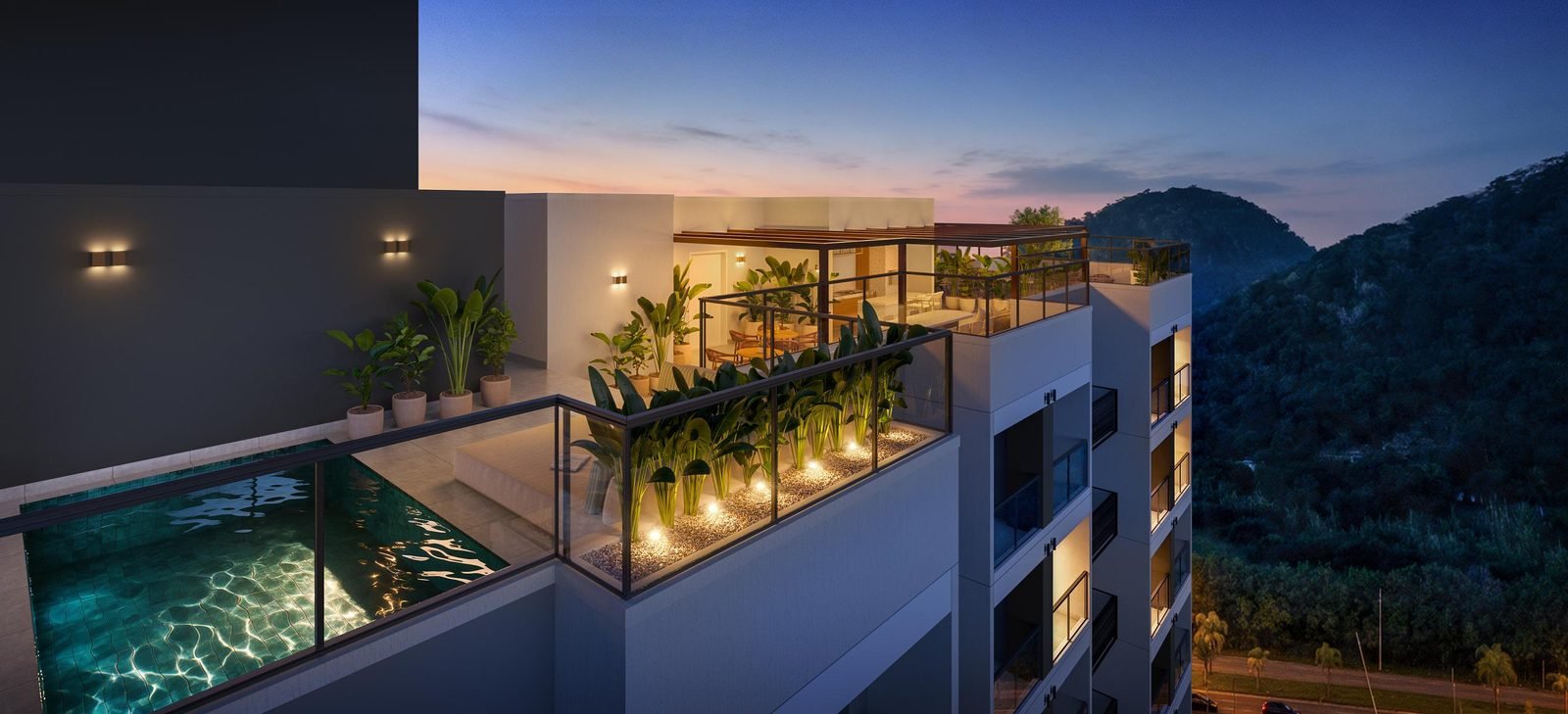 Rooftop do Ilha Stay Home Resort ao entardecer, com piscina e vista para as montanhas