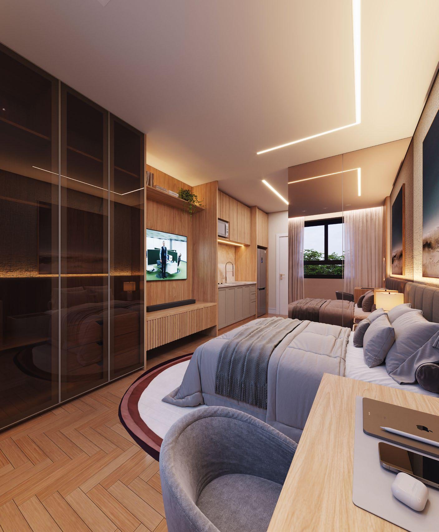 Studio decorado com cama de casal e mesa de trabalho no Lumière