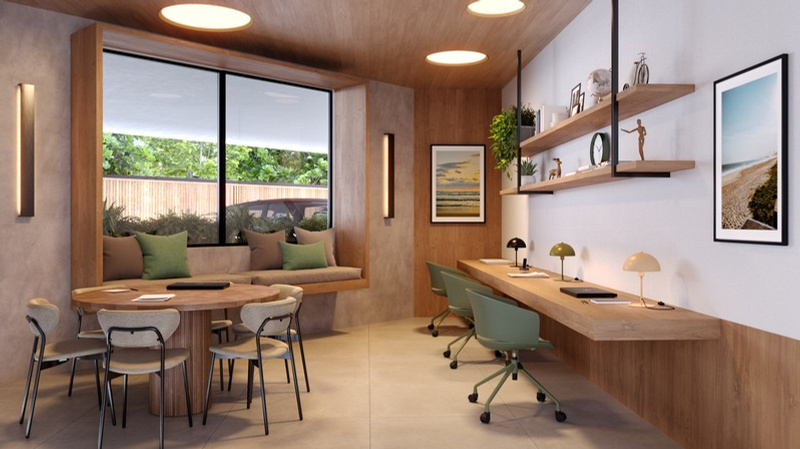 Studio decorado com bancada de trabalho e varanda integrada na Barra da Tijuca